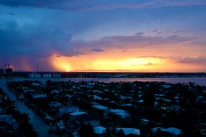 A photograph of Riviera Beach coastal properties at sunset.